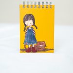 Libreta niña trenzas