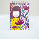 Libreta niña vestida amarillo